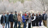 Congresswoman Janelle Bynum standing with constituents alongside the Deschutes River. 