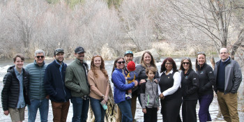 Congresswoman Janelle Bynum standing with constituents alongside the Deschutes River. 